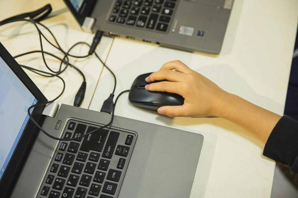 Hand using a computer mouse.