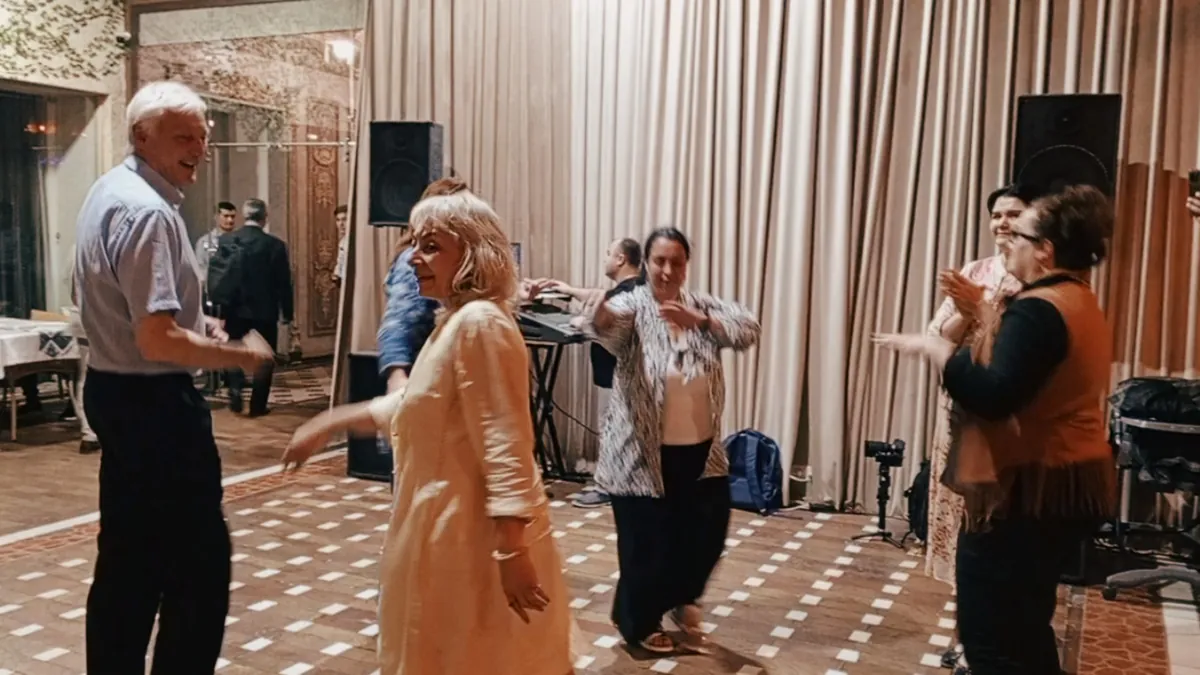 Tourists joining Uzbek dancers at an evening folk show in Samarkand