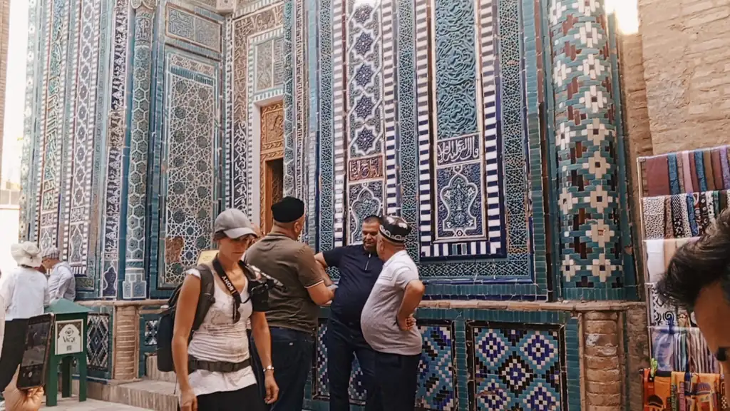 Visitors in the tiled avenue of mausoleums at Shah-i-Zinda, Samarkand
